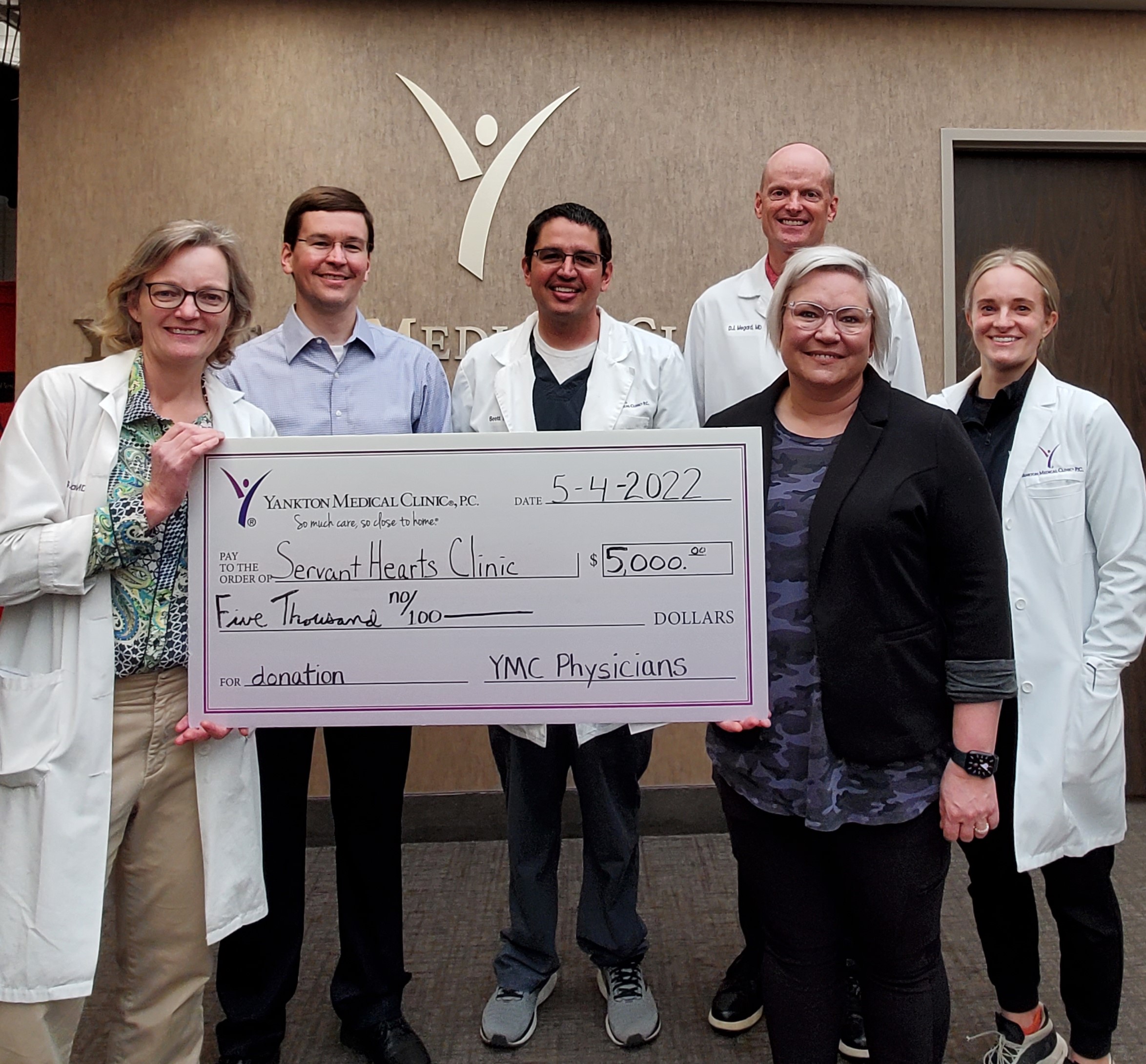 YMC Makes Donation to Servant Hearts Clinic